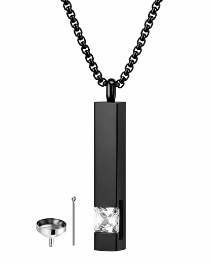 Black pendant necklace with a clear gemstone on a white background