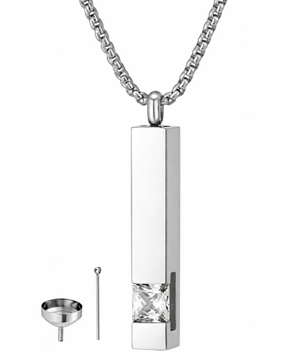 Silver pendant with a funnel and tool on a white background